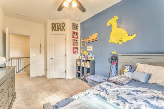 bedroom featuring light carpet, baseboards, and a ceiling fan