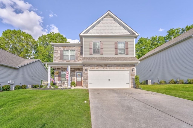 craftsman house with stone siding, a front lawn, concrete driveway, and a garage