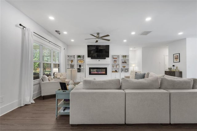 147 Wolf Creek Cv, Lagrange, GA 30240 - living room featuring a ceiling fan, a glass covered fireplace, dark wood-style flooring, and recessed lighting