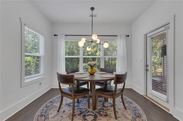 147 Wolf Creek Cv, Lagrange, GA 30240 - dining space with healthy amount of natural light, dark wood-style floors, and a chandelier