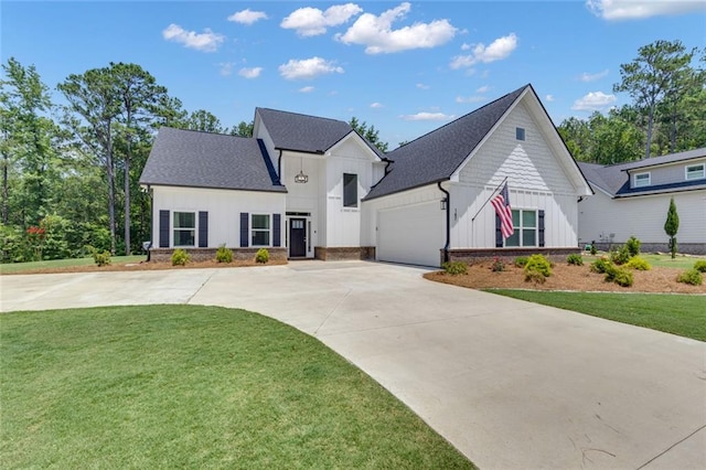 147 Wolf Creek Cv, Lagrange, GA 30240 - modern inspired farmhouse with board and batten siding, driveway, a front lawn, and an attached garage