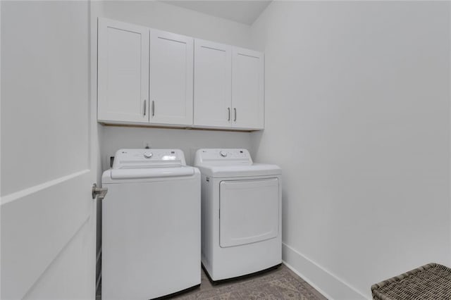 147 Wolf Creek Cv, Lagrange, GA 30240 - laundry room featuring cabinet space and washing machine and clothes dryer