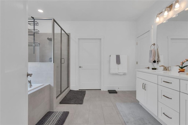 147 Wolf Creek Cv, Lagrange, GA 30240 - bathroom featuring vanity, a stall shower, a garden tub, tile patterned flooring, and recessed lighting