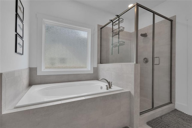 147 Wolf Creek Cv, Lagrange, GA 30240 - full bath featuring a shower stall, a bath, and healthy amount of natural light