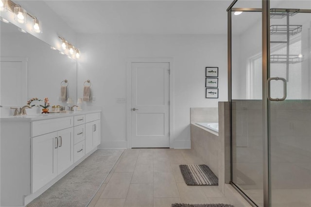 147 Wolf Creek Cv, Lagrange, GA 30240 - full bath featuring double vanity, a bath, a stall shower, and tile patterned flooring