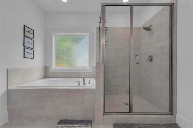 147 Wolf Creek Cv, Lagrange, GA 30240 - full bath featuring a bath, a shower stall, and tile patterned flooring