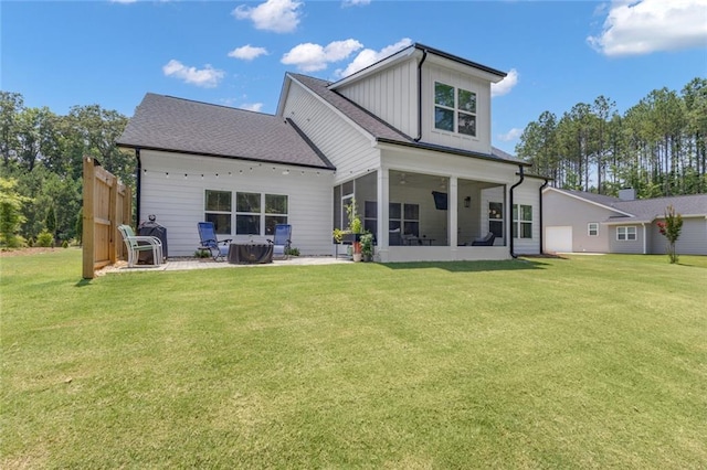147 Wolf Creek Cv, Lagrange, GA 30240 - rear view of house with a lawn, a sunroom, board and batten siding, and a patio
