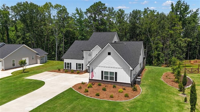 147 Wolf Creek Cv, Lagrange, GA 30240 - view of front facade featuring board and batten siding, driveway, and roof with shingles