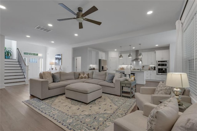 147 Wolf Creek Cv, Lagrange, GA 30240 - living room with light wood-type flooring, ceiling fan, stairs, and recessed lighting