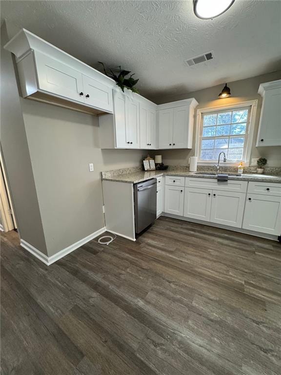 kitchen featuring white cabinetry and stainless steel dishwasher