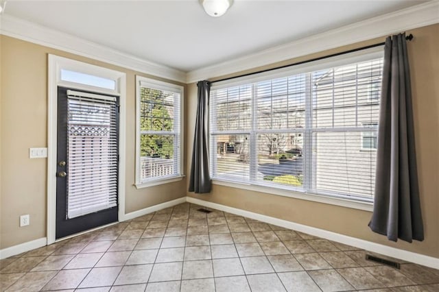 interior space featuring tile patterned floors and ornamental molding