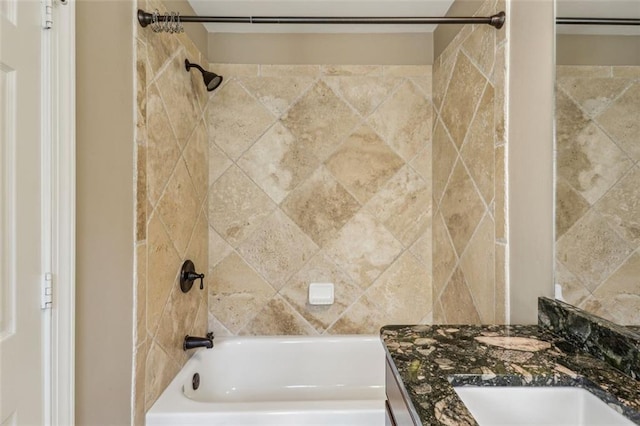 bathroom featuring vanity and tiled shower / bath combo