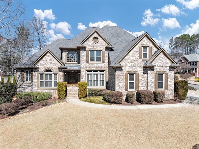 view of front of property featuring brick siding