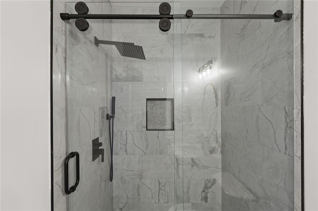 room details featuring an enclosed shower