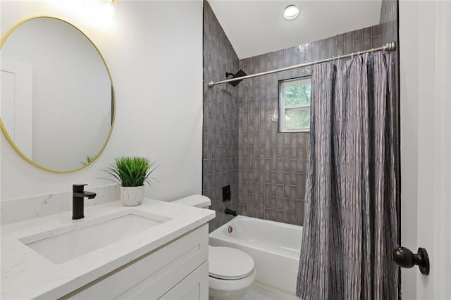 full bathroom featuring shower / bath combo with shower curtain, vanity, and toilet