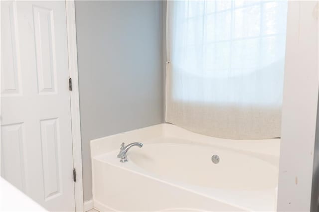 1043 Foxhollow Trl, Canton, GA 30115 - full bathroom with a bath and healthy amount of natural light