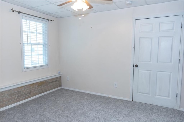 1043 Foxhollow Trl, Canton, GA 30115 - carpeted empty room with ceiling fan, a paneled ceiling, healthy amount of natural light, a smoke detector, and baseboards