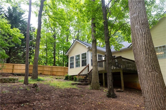 1043 Foxhollow Trl, Canton, GA 30115 - rear view of property featuring a wooden deck, fence, and stairway