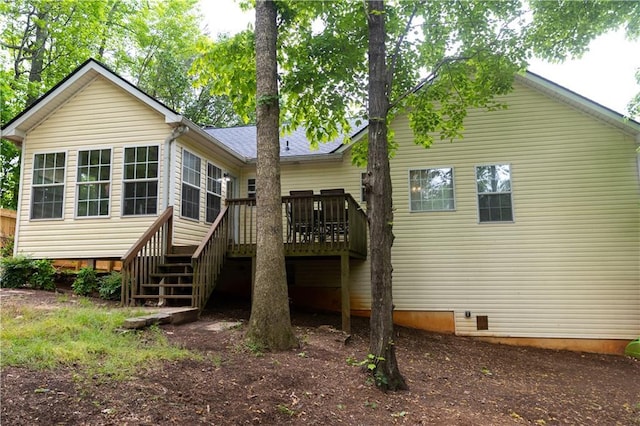 1043 Foxhollow Trl, Canton, GA 30115 - back of property featuring a wooden deck, stairs, and crawl space