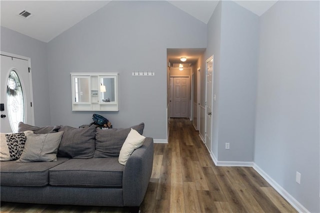 1043 Foxhollow Trl, Canton, GA 30115 - living area with wood finished floors, baseboards, and high vaulted ceiling