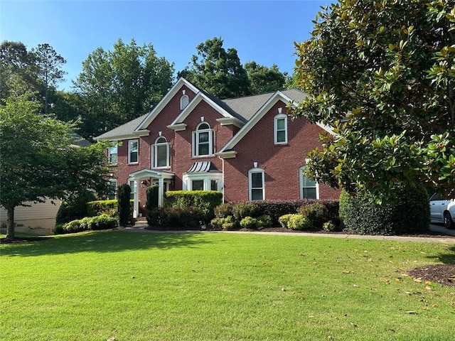 4265 Lansmoore Xing, Suwanee, GA 30024 - view of front of home with a front lawn and brick siding