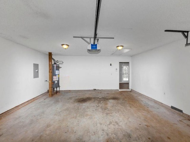 garage with electric panel, a garage door opener, and water heater