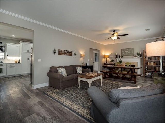 living room featuring dark wood-style floors, ceiling fan, and crown molding