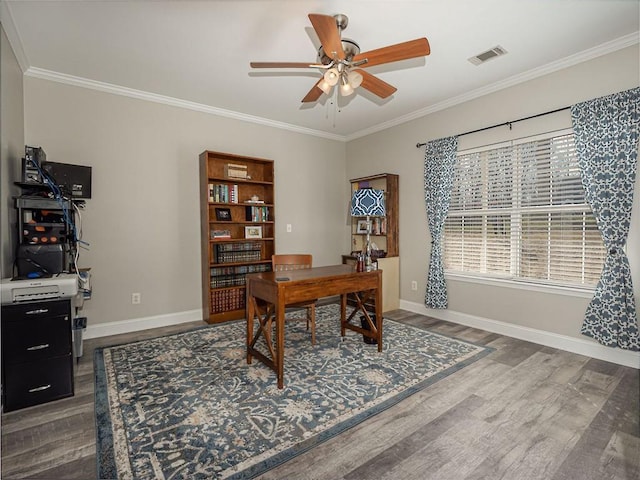 office space with a ceiling fan, visible vents, dark wood-style flooring, and ornamental molding