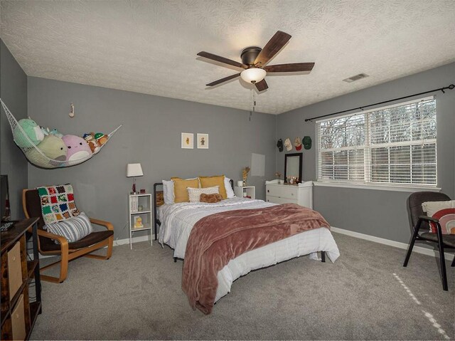 bedroom featuring visible vents, baseboards, and carpet floors