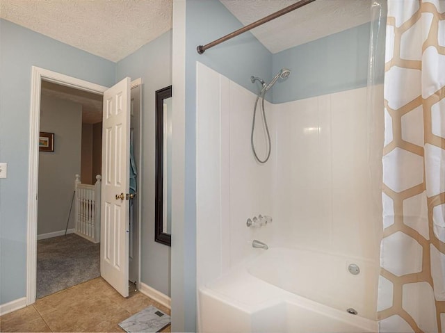 full bath featuring baseboards, a textured ceiling, tile patterned flooring, and shower / bath combination with curtain