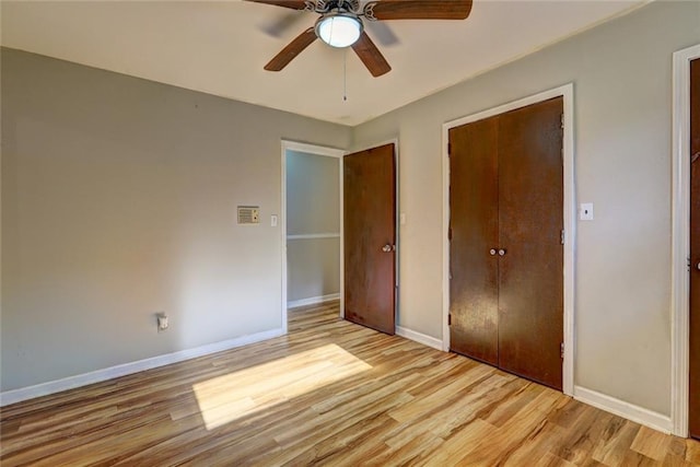 unfurnished bedroom with light hardwood / wood-style floors and ceiling fan