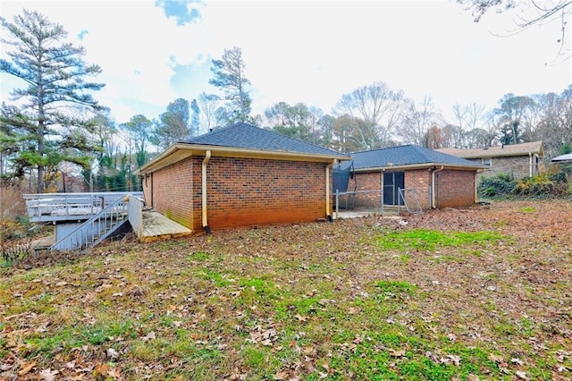 rear view of house with a deck