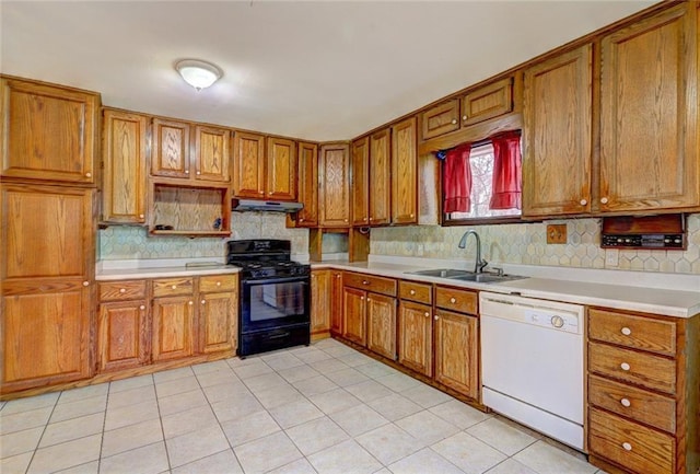 kitchen featuring dishwasher, sink, black range with gas cooktop, decorative backsplash, and light tile patterned flooring