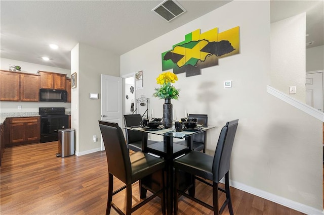 dining area with hardwood / wood-style floors