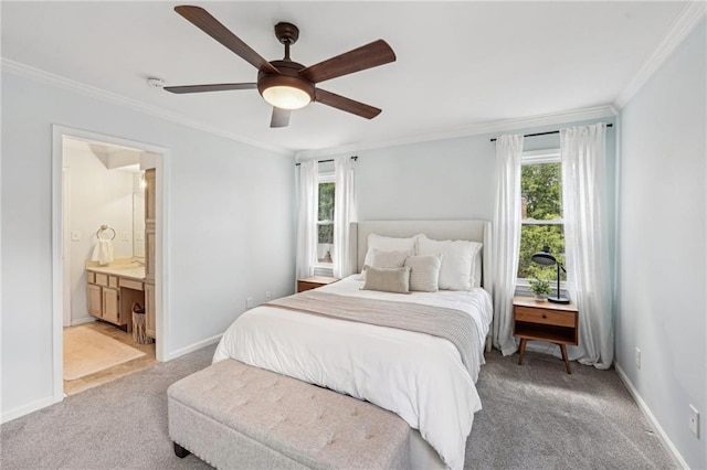 bedroom featuring light colored carpet, ornamental molding, multiple windows, baseboards, and connected bathroom