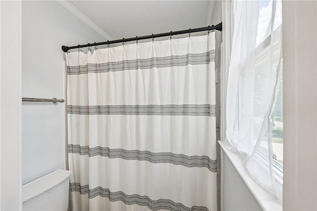 full bathroom with a shower with shower curtain and ornamental molding