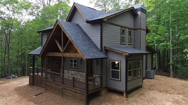34 Cherry Ct, Ellijay, GA 30540 - back of house with roof with shingles, cooling unit, a forest view, and a porch