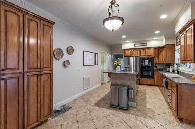 kitchen featuring stainless steel fridge, a kitchen island, light tile patterned floors, crown molding, and double oven