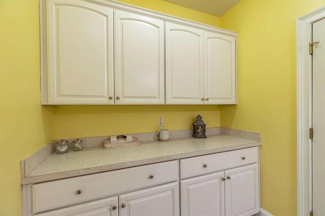 kitchen featuring white cabinets