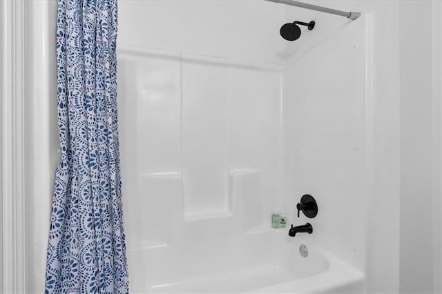 full bath featuring shower / bath combination with curtain