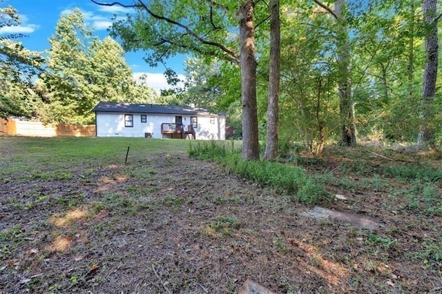 view of yard featuring a wooden deck