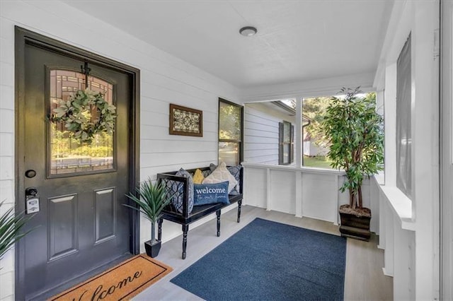 entrance to property featuring covered porch