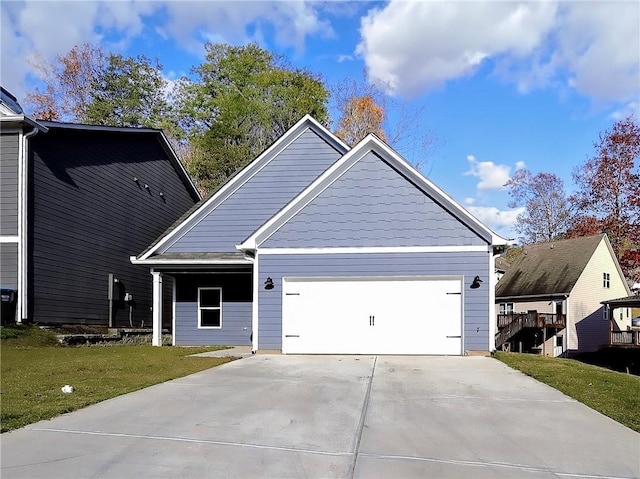 view of front facade featuring a garage and a front lawn