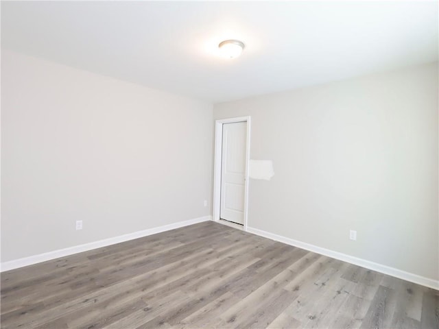 empty room featuring hardwood / wood-style floors