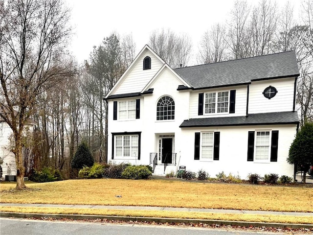 view of property with a front lawn