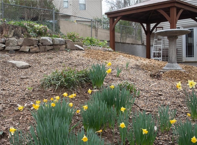 view of yard featuring a gazebo and fence