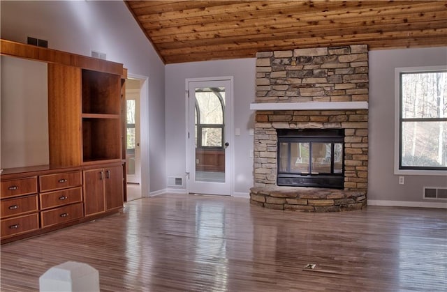 unfurnished living room with visible vents, baseboards, lofted ceiling, and wood finished floors