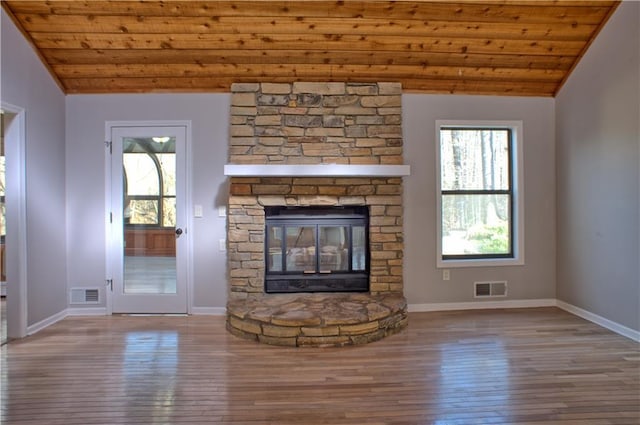 unfurnished living room with wood-type flooring, visible vents, wooden ceiling, and vaulted ceiling