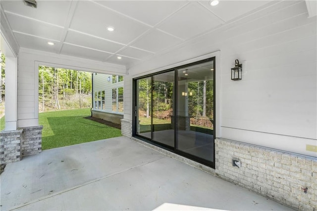 unfurnished sunroom featuring coffered ceiling