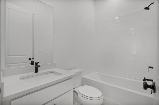 bathroom featuring toilet, vanity, and shower / bathing tub combination